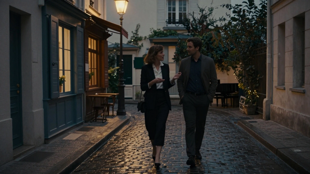 A discreet evening walk through Montmartre, two well-dressed figures lost in quiet conversation under streetlamps.
